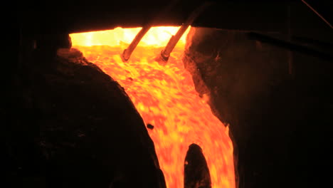 Molten-metal-start-pouring-from-blast-furnace.-Metallurgical-industry